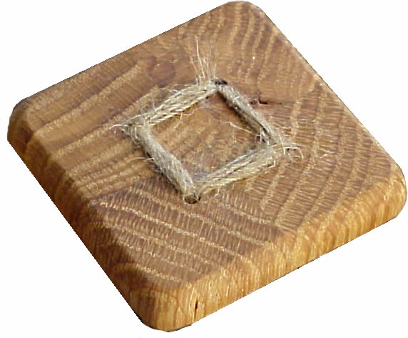 WB04 4-piece oak wood button. Sold in package of 10 pieces.