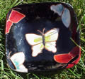 Black clay plate with butterflies