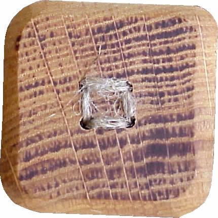 WB03 oak wood button. Sold in package of 10 pieces.