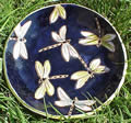 Dark blue clay plate with yellow dragonflies